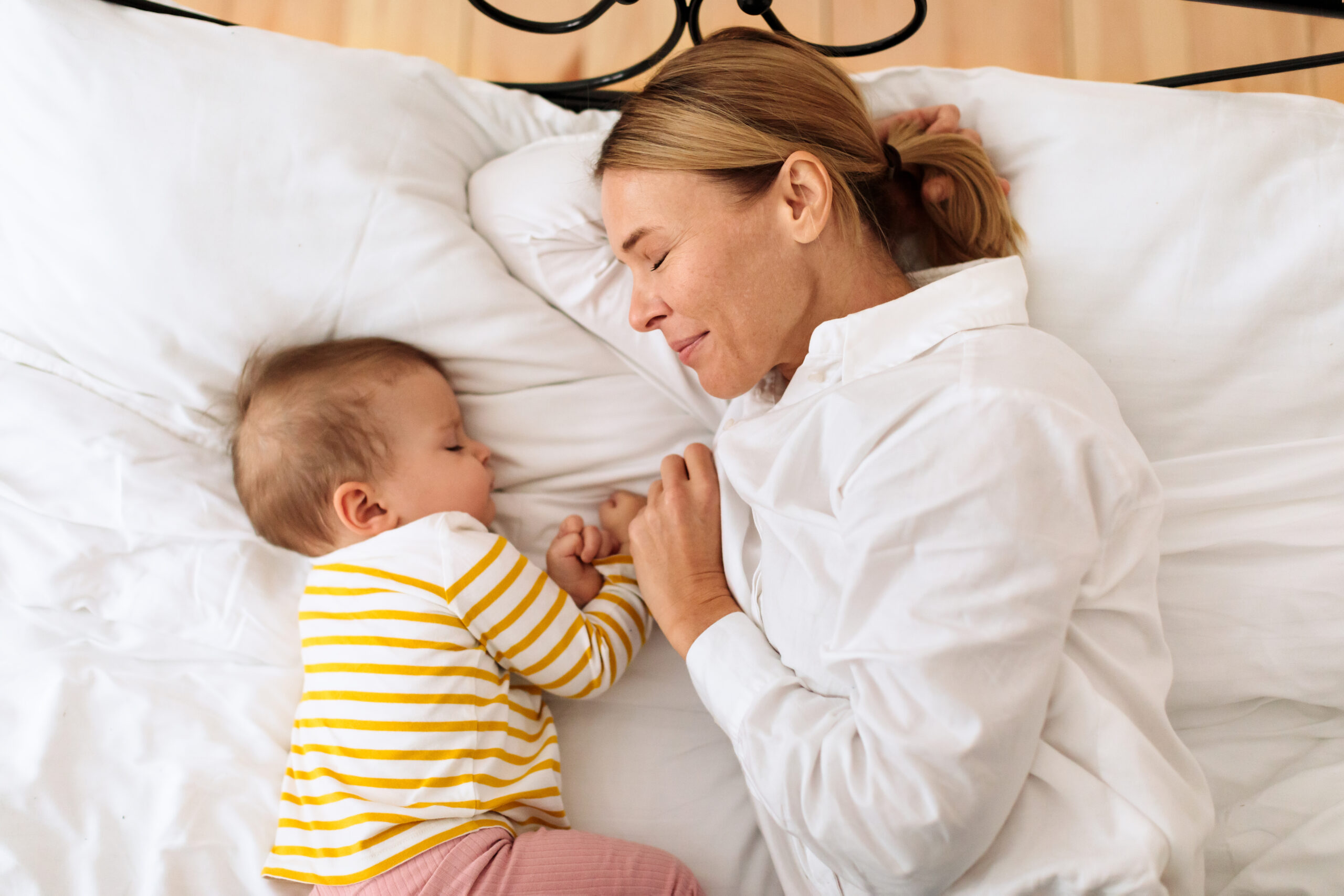 loving mother with her baby sleeping together