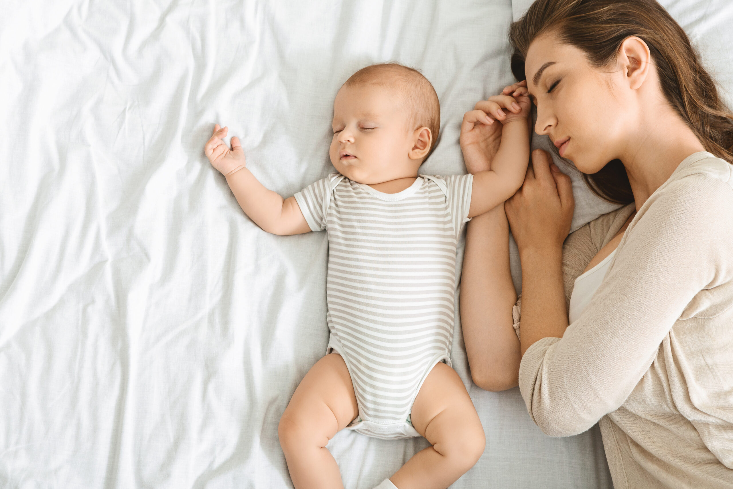 sleeping infant with mother
